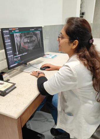 Dr. Shalini Singh examining the Dental X-ray in the system