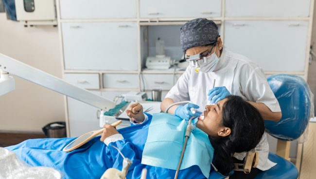 A doctor doing the Extraction to a women.